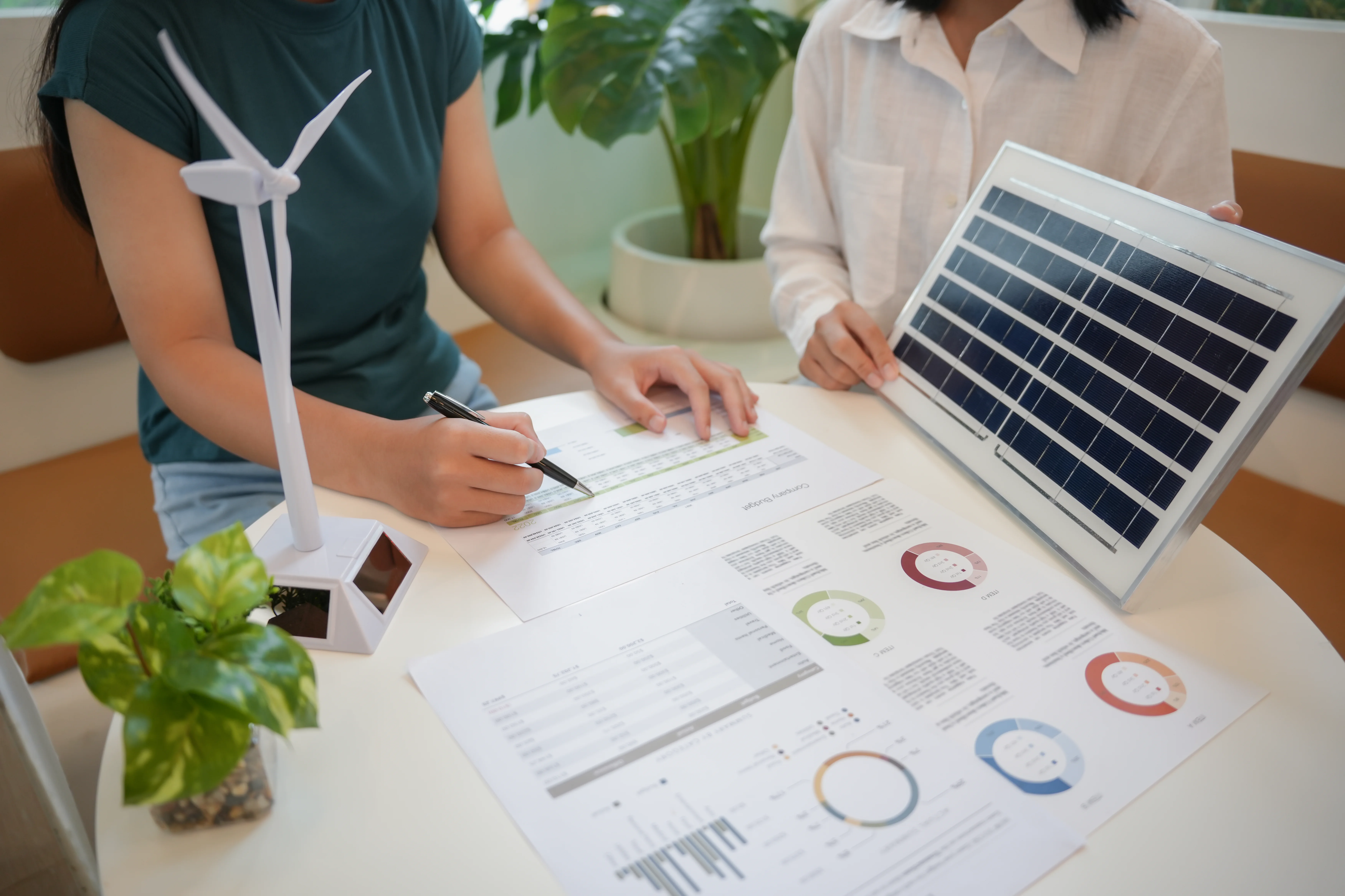 Team analyzing renewable energy data and solar panel technology