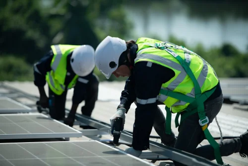 Solar panel installation team at work